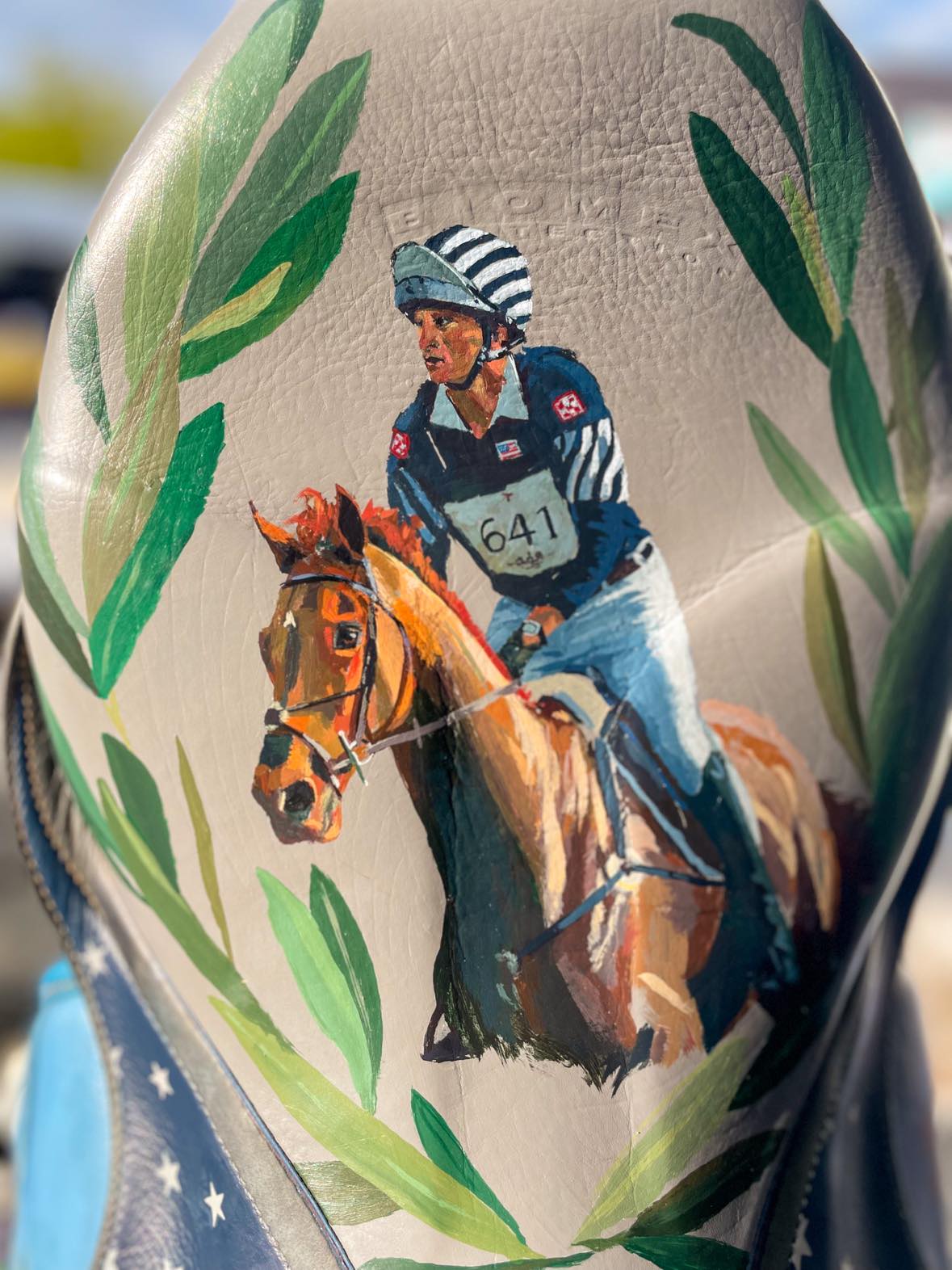Decorative equestrian painting on a used saddle with Boyd Martin riding his olympic eventing horse