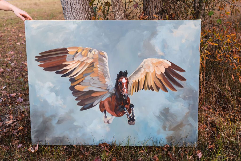 Painting of a horse with wings held by a person outdoors.